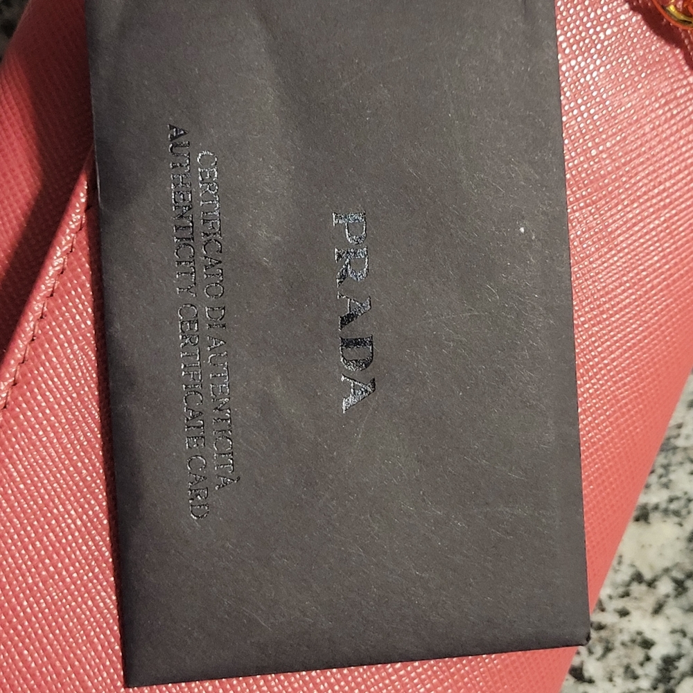 Prada fushia clutch with threaded leather